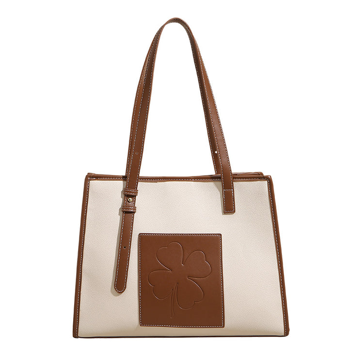 Damen elegante Tote-Tasche mit strukturiertem Leder und verspieltem Kleeblatt-Akzent Nord Taschen