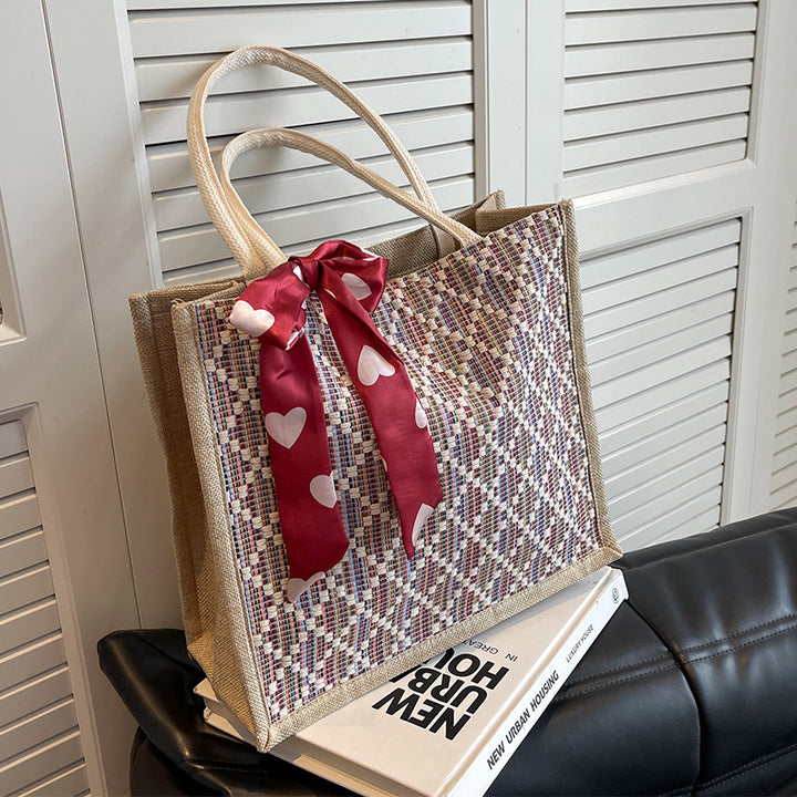 Damen Jute-Einkaufstasche mit buntem Grafikdesign und dekorativem Schleifenakzent Nord Taschen