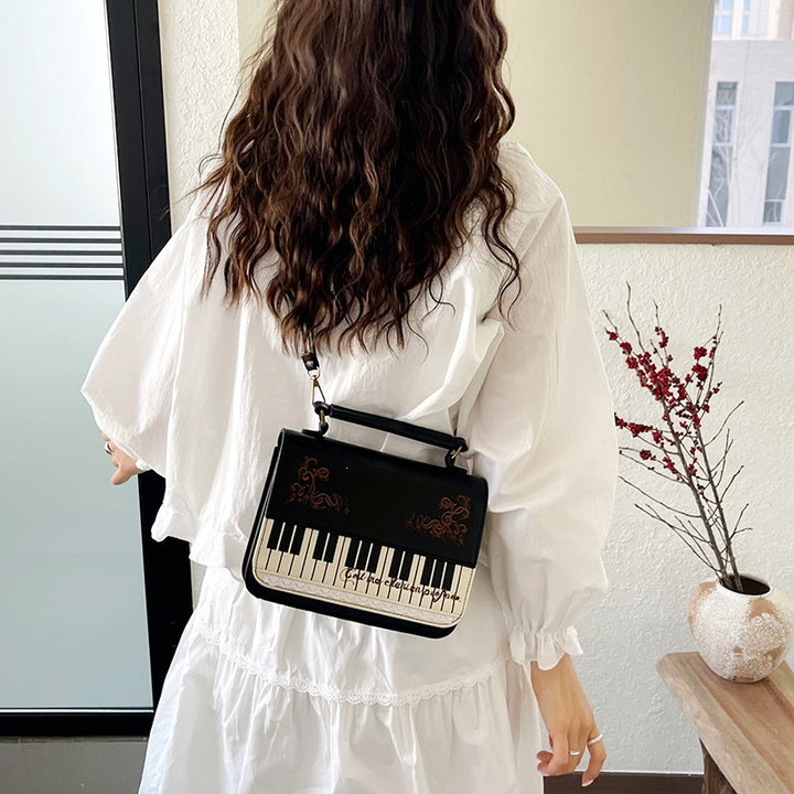 Damen Handtasche mit Klaviermotiv Nord Taschen
