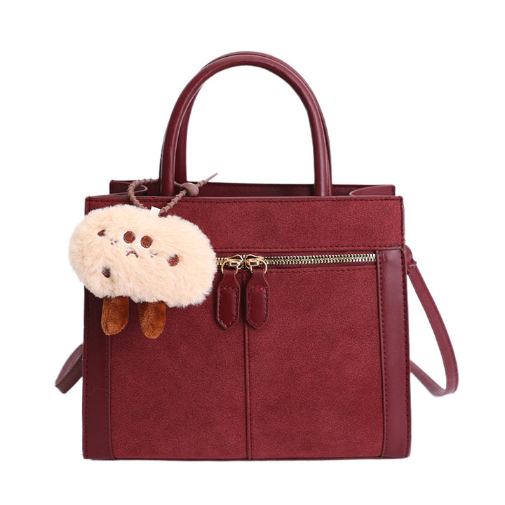 Damen stilvolle Handtasche mit charmantem Schlüsselanhänger Nord Taschen