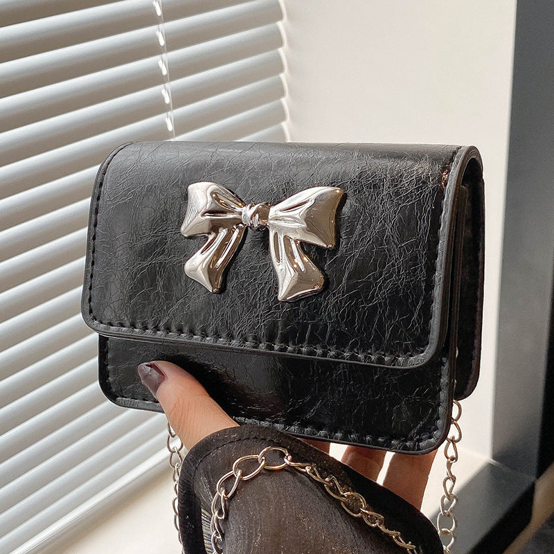 Damen Clutch mit zauberhaftem Schleifendetail und edlem Kettenriemen Nord Taschen