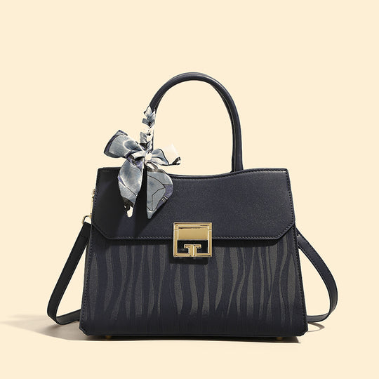 Damen Handtasche mit verstellbarem Schulterriemen und elegantem Schleifenakzent Nord Taschen