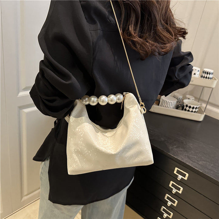 Damen Umhängetasche mit Perlenhenkel und eleganter Schlangenprägung Nord Taschen