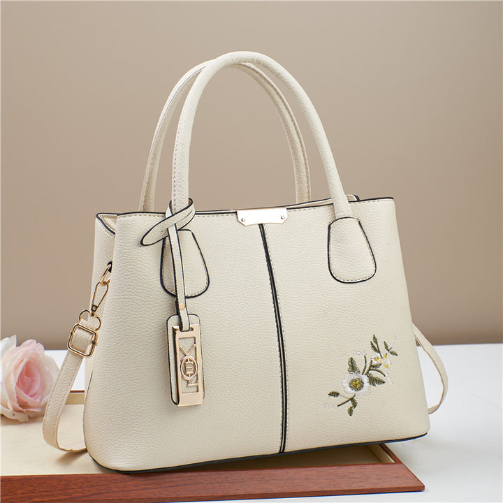 Damen Umhängetasche mit floralem Stickdesign und abnehmbarer Quaste Nord Taschen