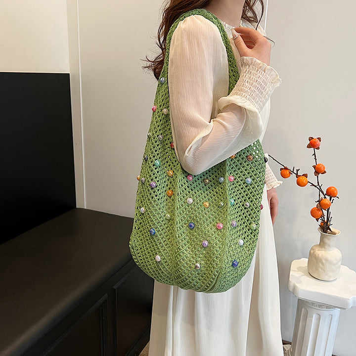 Damen stilvolle Beuteltasche aus geflochtenem Netzmaterial mit bunten Perlen Nord Taschen