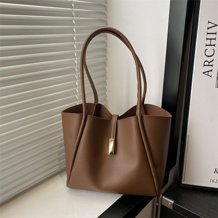 Damen elegante Tragetasche mit goldenen Akzenten Nord Taschen