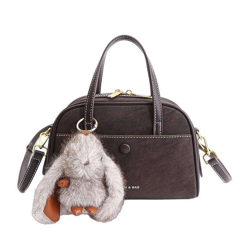 Damen kompakte Handtasche mit verspieltem Tieranhänger Nord Taschen