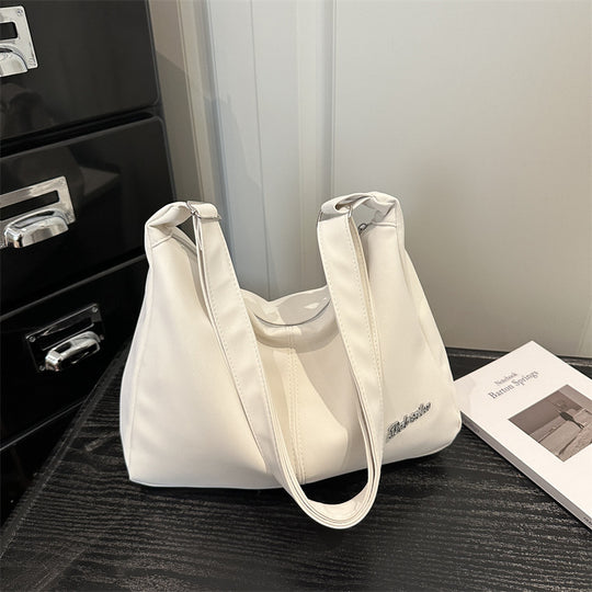 Damen Umhängetasche mit eleganter Struktur und Filterverschluss Nord Taschen