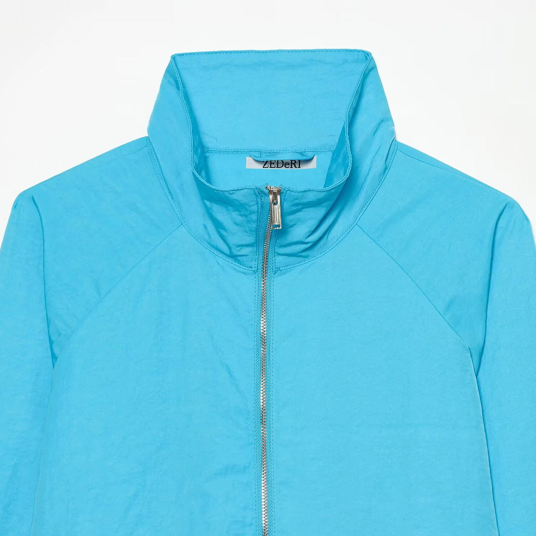 Damen Ultraleichte Cropped-Windjacke mit Stehkragen, Raglanärmeln und Reißverschluss Nord Taschen