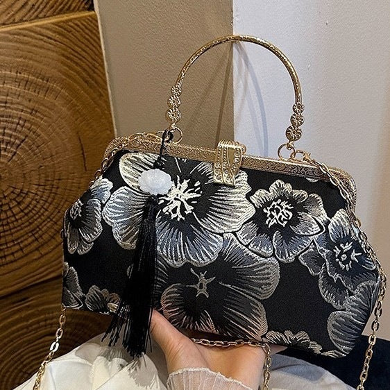 Damen elegante Clutch-Tasche mit floralem Druck und goldenen Akzenten Nord Taschen