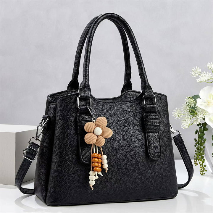 Damen elegante Handtasche mit verspieltem Anhänger Nord Taschen