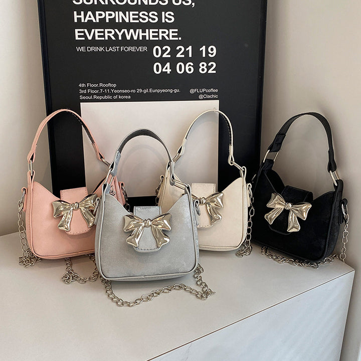 Damen Handtasche mit glänzendem Schleifenverschluss Nord Taschen