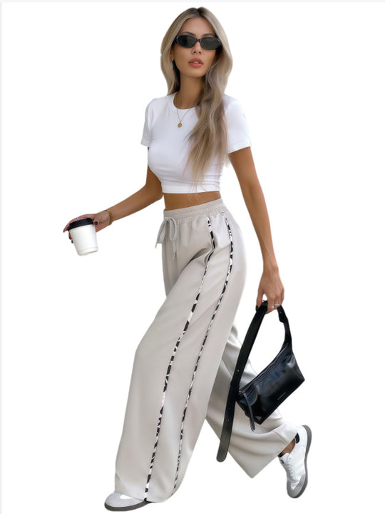 Damen Weite High‑Waist Loungehose mit Kordelzug und kontrastierenden Seitenstreifen Nord Taschen