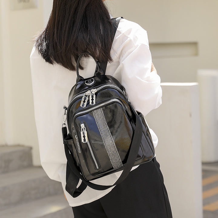 Damen Mini-Rucksack mit stylischen Reißverschlusstaschen und dekorativem Anhänger Nord Taschen