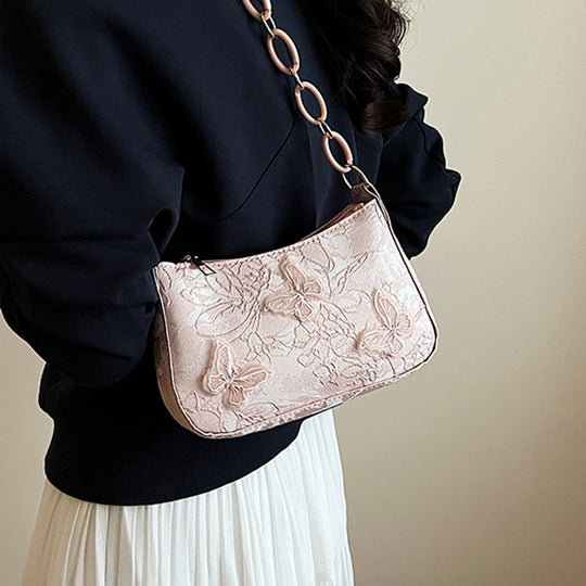 Damen Handtasche mit handgearbeitetem Blumenmuster und modischem Kettenriemen Nord Taschen