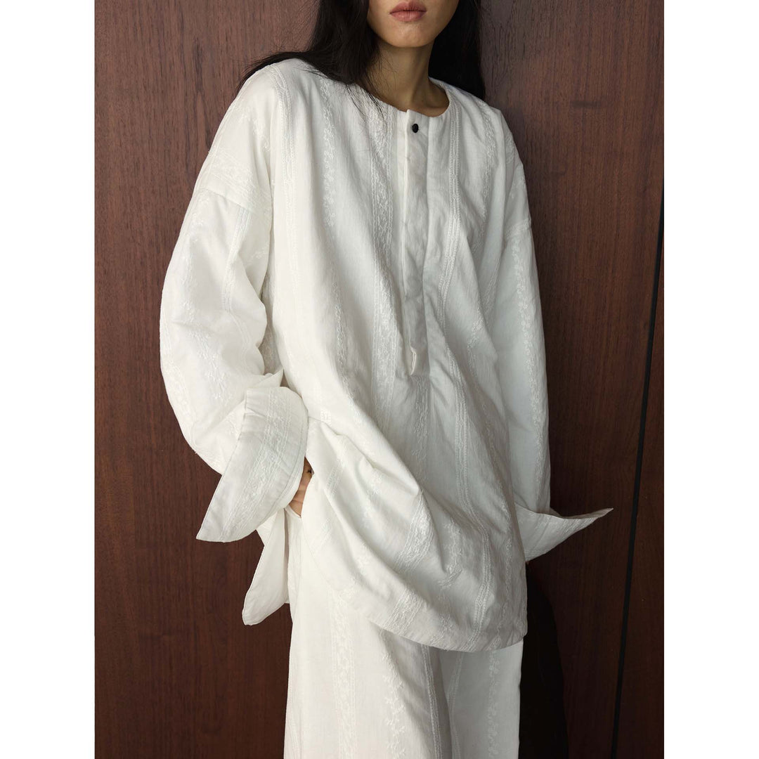 Damen Oversized strukturierte Longbluse mit Rundhals und verlängertem Saum Nord Taschen