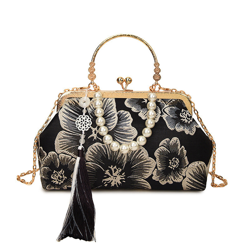 Damen elegante Abendtasche mit floralem Design und attraktiver Kettenakzent Nord Taschen