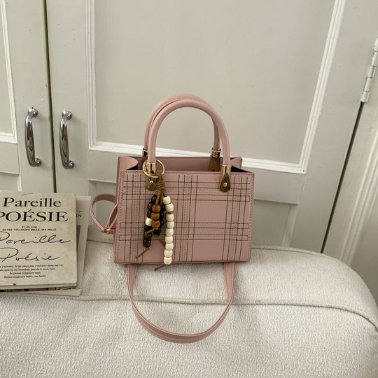 Damen Mini-Handtasche mit eleganter Struktur und goldenen Akzenten Nord Taschen