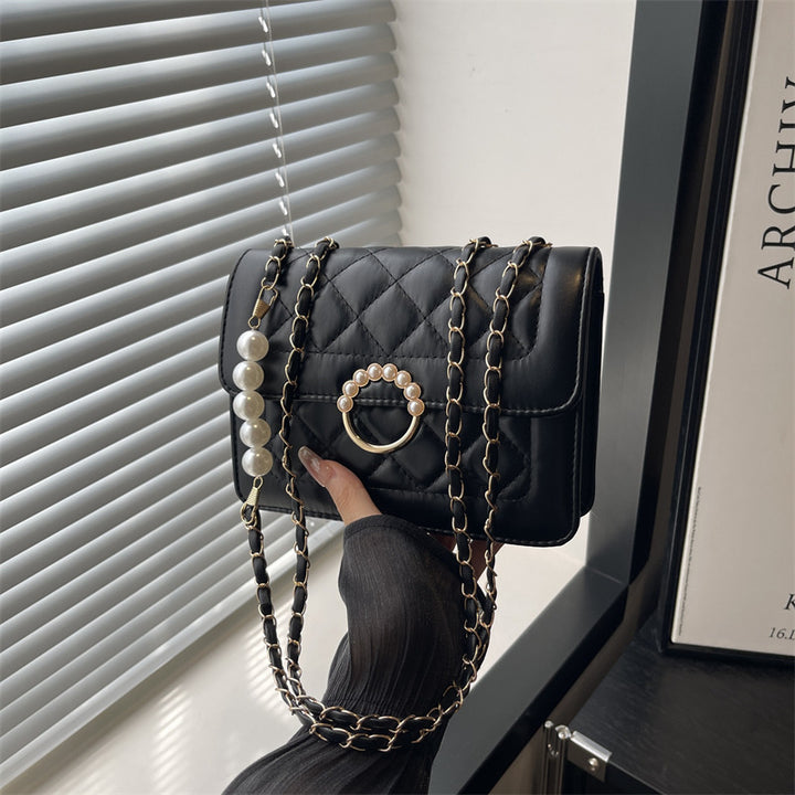 Damen elegante Handtasche mit strukturiertem Design und femininen Perlenakzenten Nord Taschen