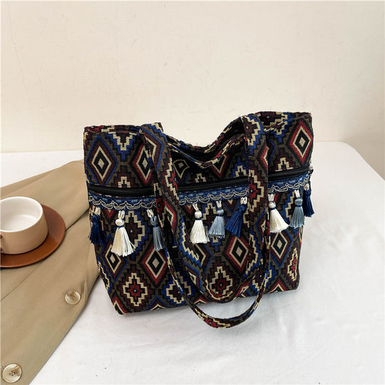 Damen Umhängetasche mit modernem Ethno-Muster und verspielten Quasten Nord Taschen