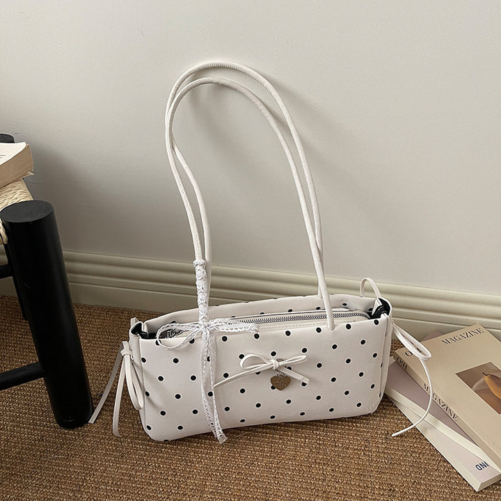 Damen Handtasche mit spielerischem Punktemuster und eleganten Details Nord Taschen