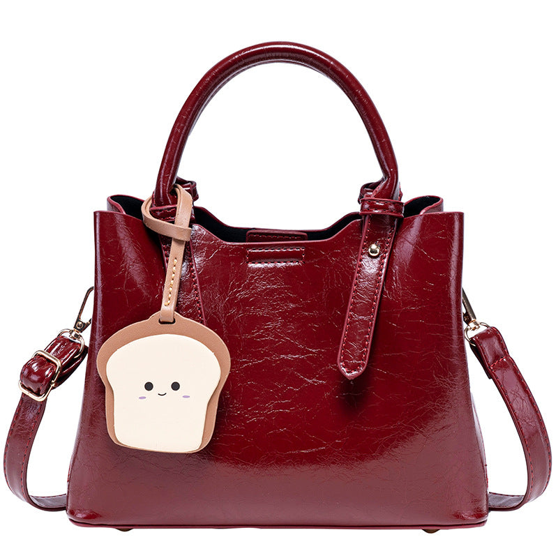 Damen modische Handtasche mit verspieltem Anhänger Nord Taschen
