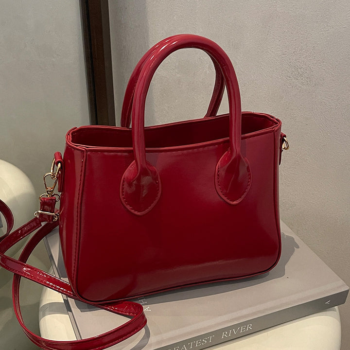 Damen elegante Handtasche aus glänzendem Kunstleder Nord Taschen