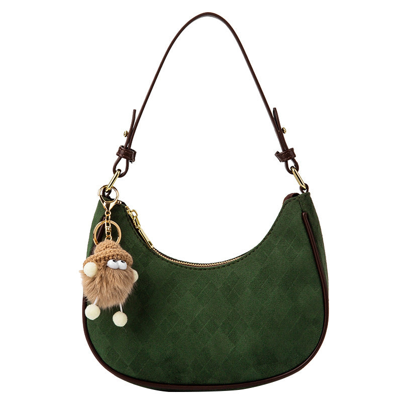 Damen Handtasche aus hochwertigem Wildleder mit verspieltem Anhänger | Nord Taschen