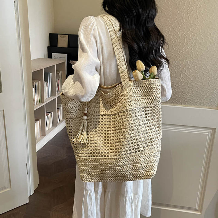 Damen elegante Strandtasche mit ausgefallenem Häkel-Design und dekorativen Quasten Nord Taschen