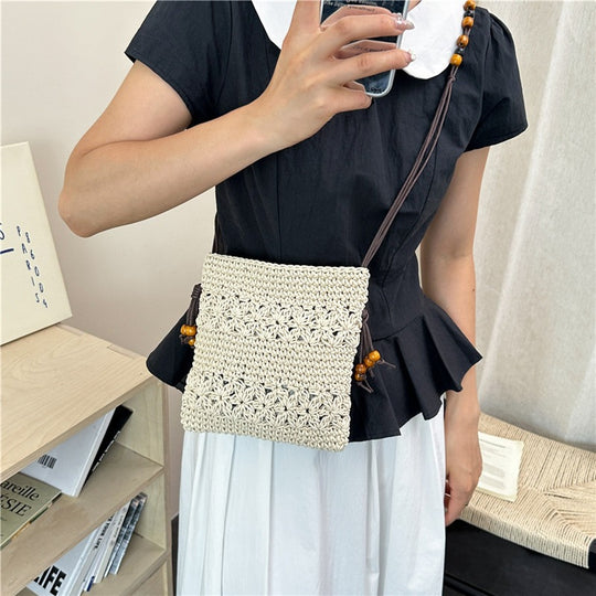 Damenhandtasche aus handgewebtem Naturmaterial mit verspielten Details Nord Taschen
