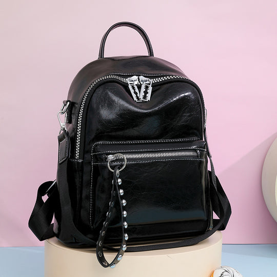 Damen Rucksack mit schimmerndem Metallic-Finish und dekorativem Anhänger Nord Taschen