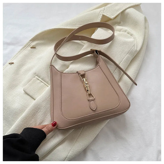 Nord Taschen | Umhängetasche für Damen - Schlichte Schultertasche mit stilvollem Design und praktischer Schnalle