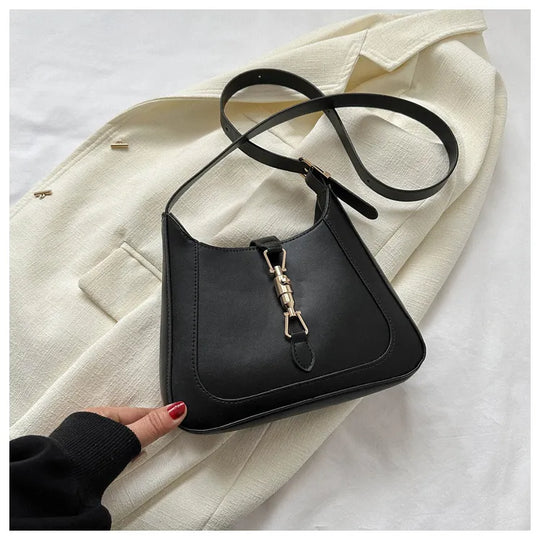 Nord Taschen | Umhängetasche für Damen - Schlichte Schultertasche mit stilvollem Design und praktischer Schnalle