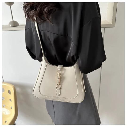 Nord Taschen | Umhängetasche für Damen - Schlichte Schultertasche mit stilvollem Design und praktischer Schnalle